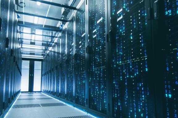 Corridor in a data centre with cabinets either side