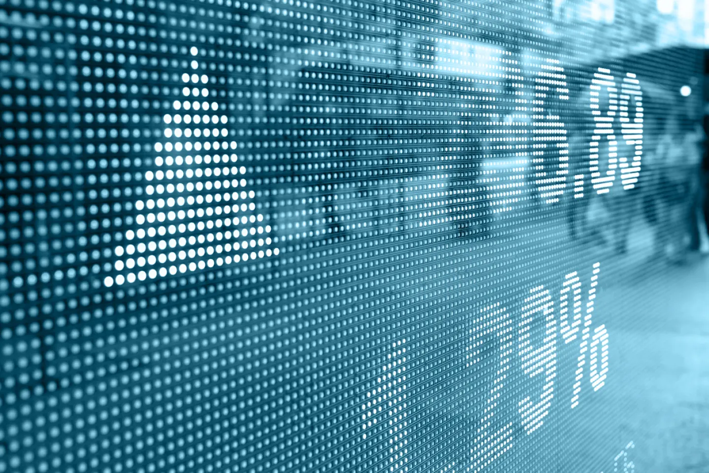 Stock market charts displayed on large outdoor screen